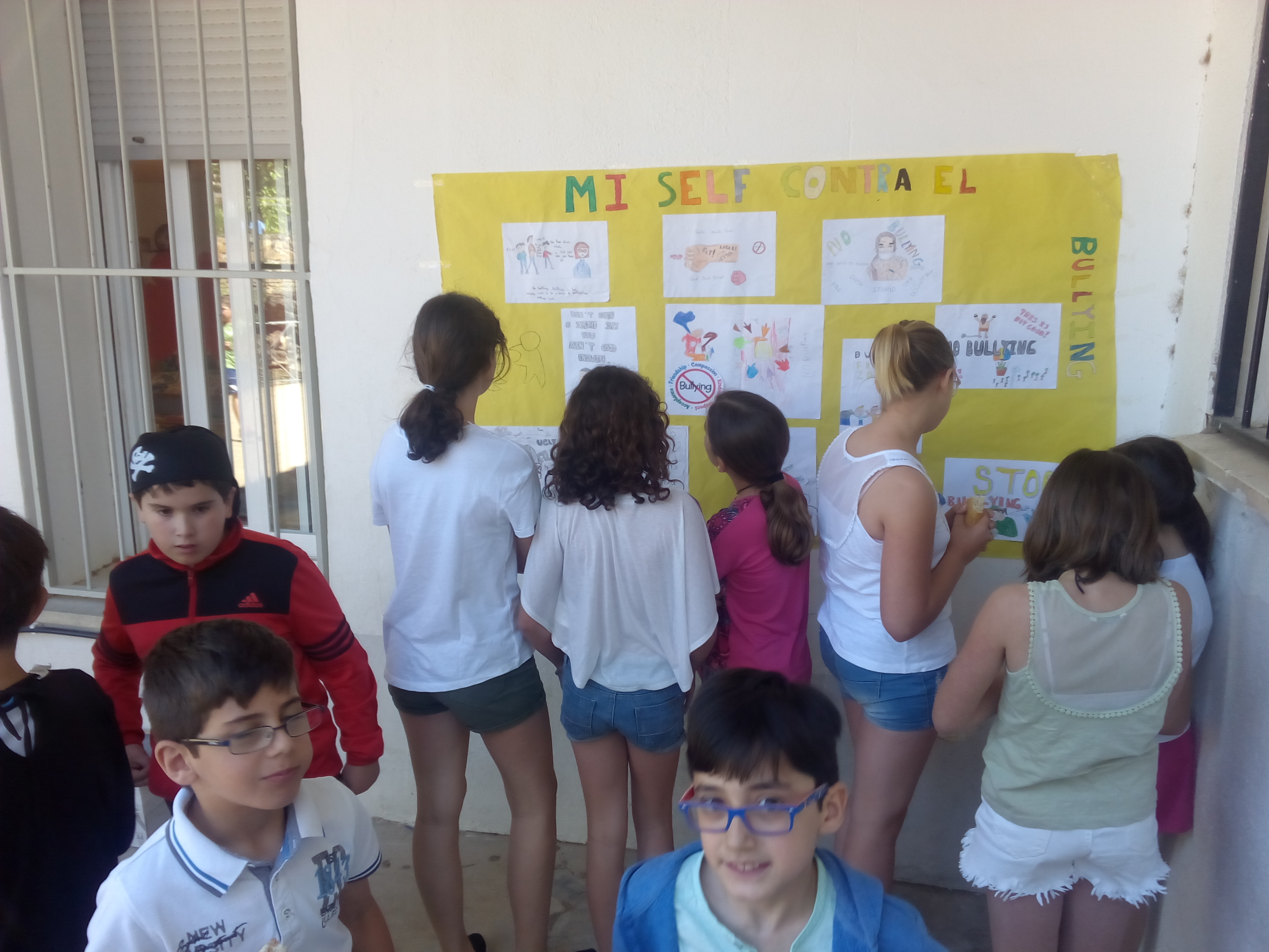 Exhibition of collaborative posters against bullying in the playground
